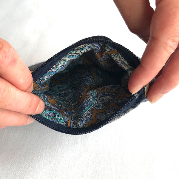 Inside of Tweed purse with blue and beige paisley pattern fabric