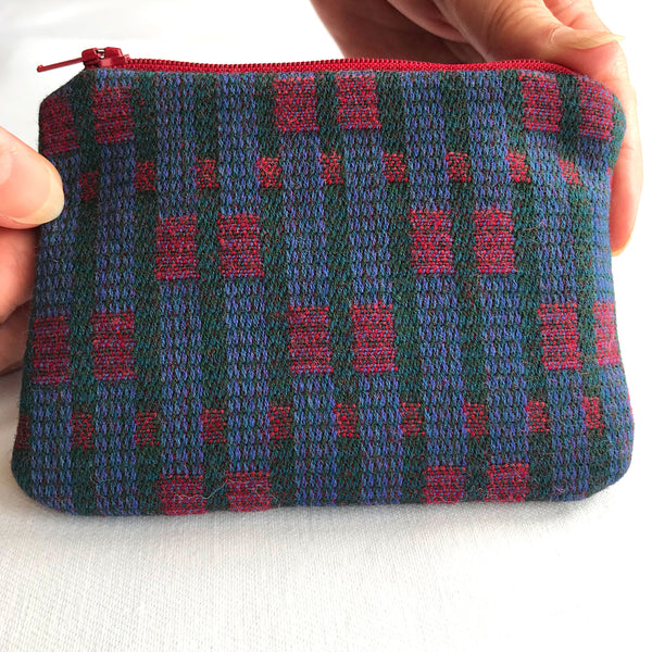 Reverse of tweed purse with blue and red tweed fabric..