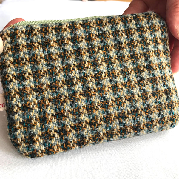 Reverse side of purse with beige, green and brown tweed