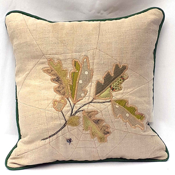 Handmade cushion with leaf design and applique made from mixed upcycled fabrics