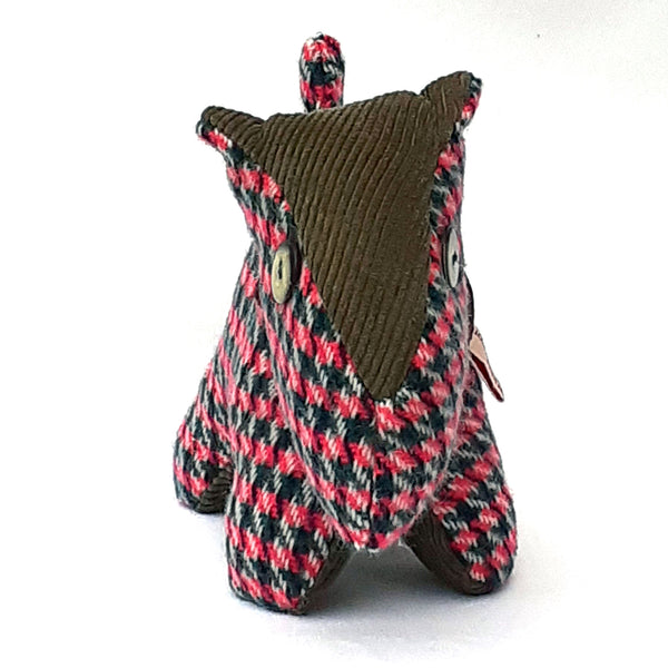 Front view of pink tweed scottie dog with a khaki corduroy nose and button eyes. ReTweed label on collar.