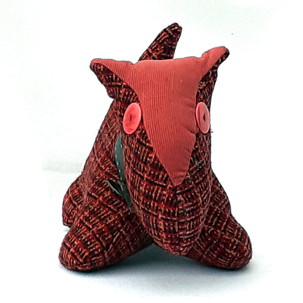 Front view of soft toy scottie dog, with red tweed fabric, and pink corduroy nose and collar 