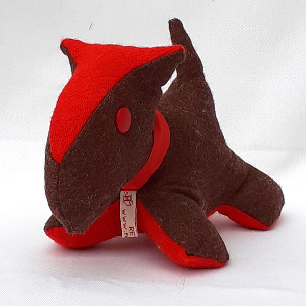 Front view of handmade scottie dog with brown tweed fabric, red stomach, nose, collar and button eye. ReTweed label hangs around its neck