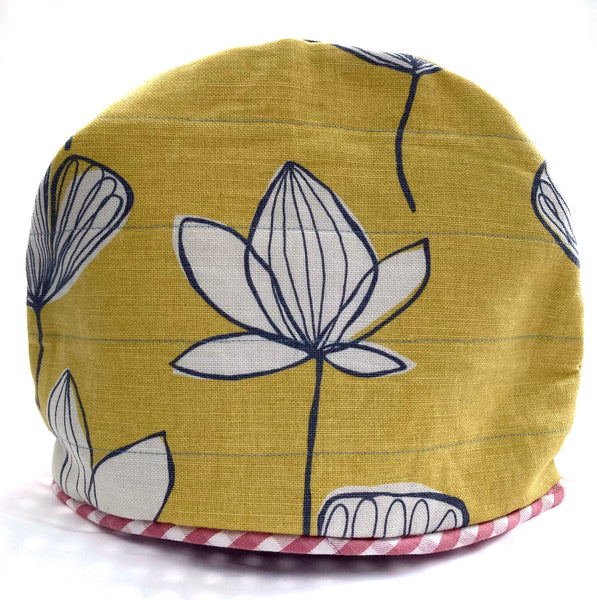 Yellow tea cosy made with upcycled fabric