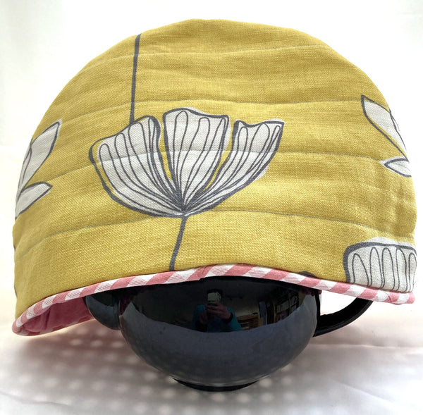 Yellow tea cosy made with upcycled fabric